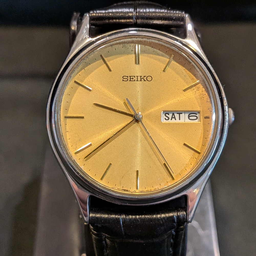 Seiko Gold Dial Watch with Black Leather Strap
